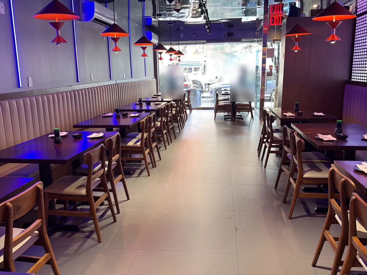 Dining room with red pendant lamps at Kikoo Sushi East Village