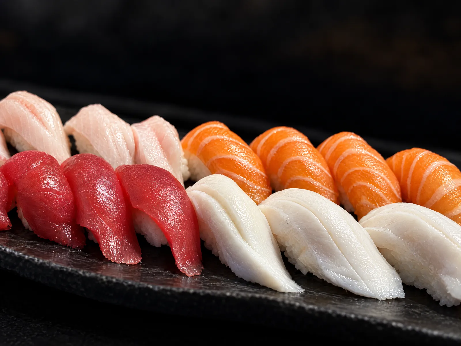 Tuna, salmon and white fish nigiri at Kikoo Sushi East Village