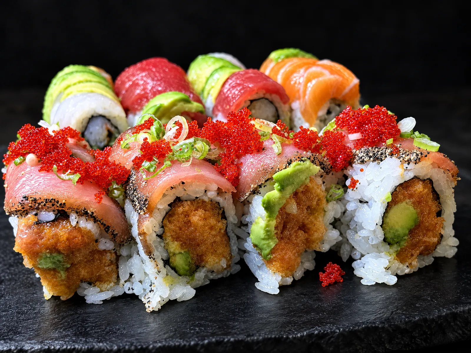 Special rolls topped with tuna, salmon, avocado and tobiko at Kikoo Sushi East Village